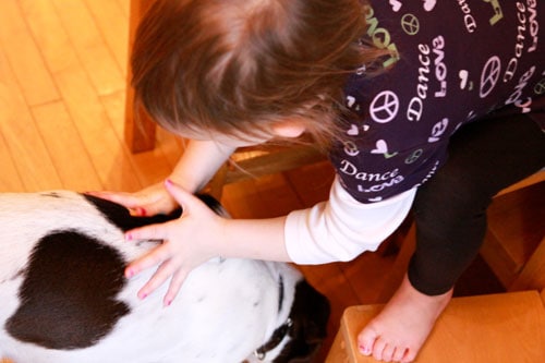 Olivia putting stickers on AJ Potty Training Chart and Stickers