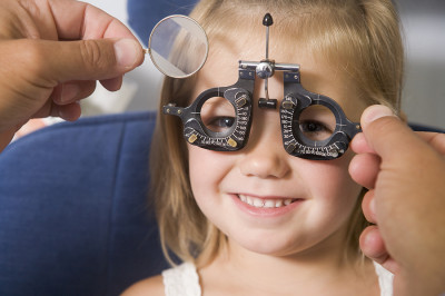 bigstock-Optometrist-In-Exam-Room-With--4137225