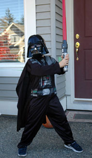 Child wearing Darth Vader Halloween Costume