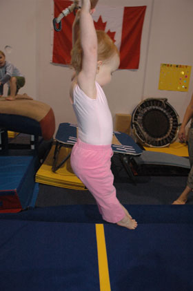 Julia at Gymnastics on Trapeze