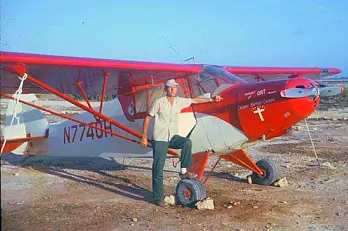 Jim Cooper in front of his prized plane.