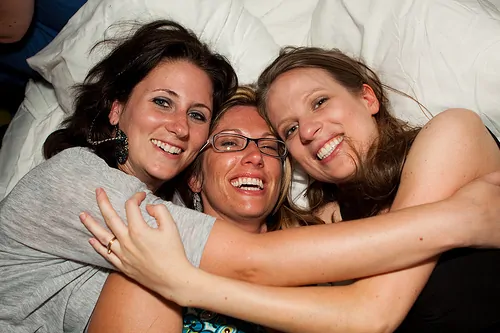 Laughing on the Beds at the CheeseburgHer Party