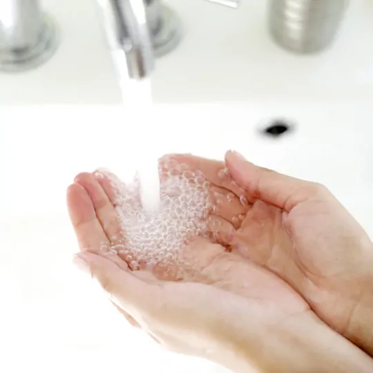 Hands Under a Running Faucet