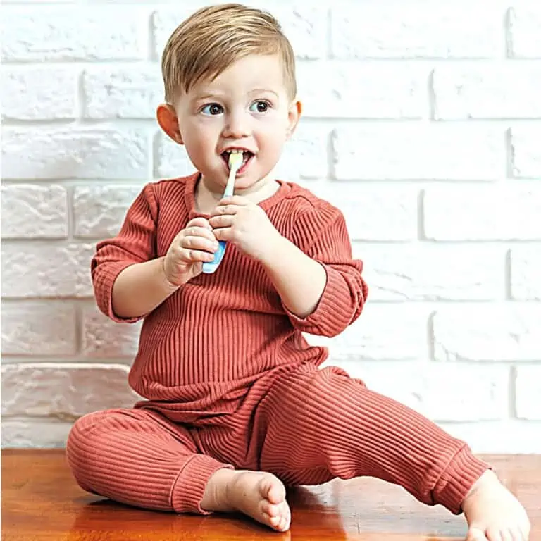 Small child brushing his teeth