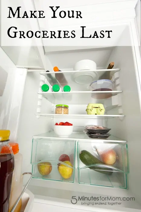 Inside view of a modern open fridge with fresh food