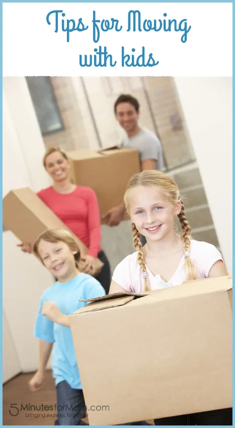 Family happy on moving day carrying cardboard boxes