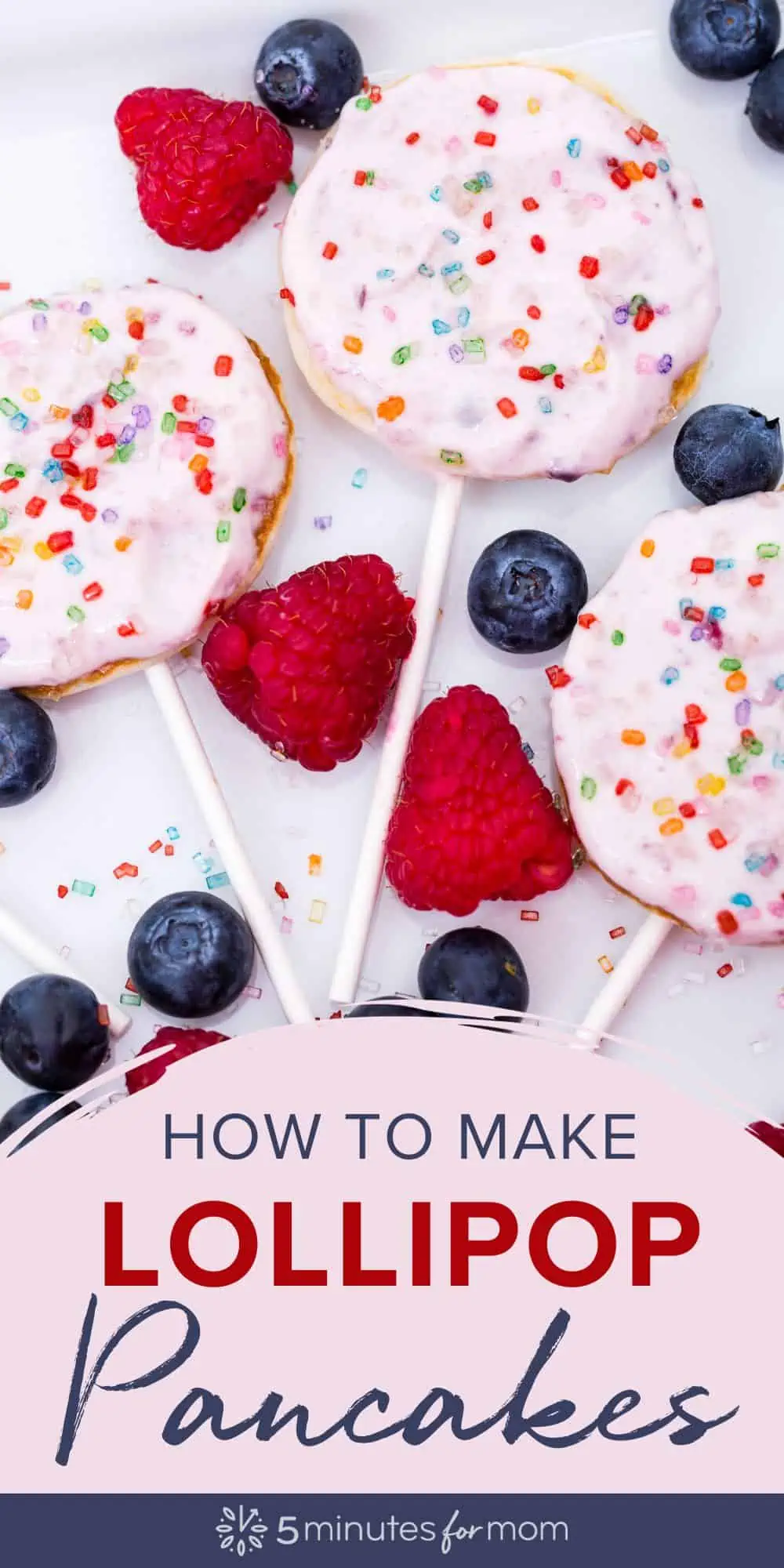 Small pancakes with pink icing and sprinkles on lollipop sticks with blueberries and raspberries next to them. Text overlay says How to Make Lollipop Pancakes