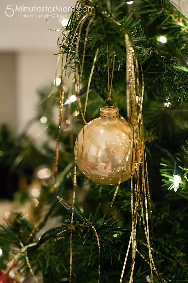 decorating Christmas tree with tinsel