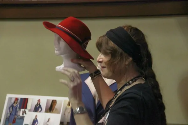 Agent-Carter-Wardrobe-Gigi-Melton-holds-red-hat