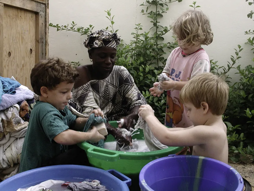 It took a while for the European washing machine to be shipped from Spain. Here are the 3 kids learning how to wash clothes the African way.