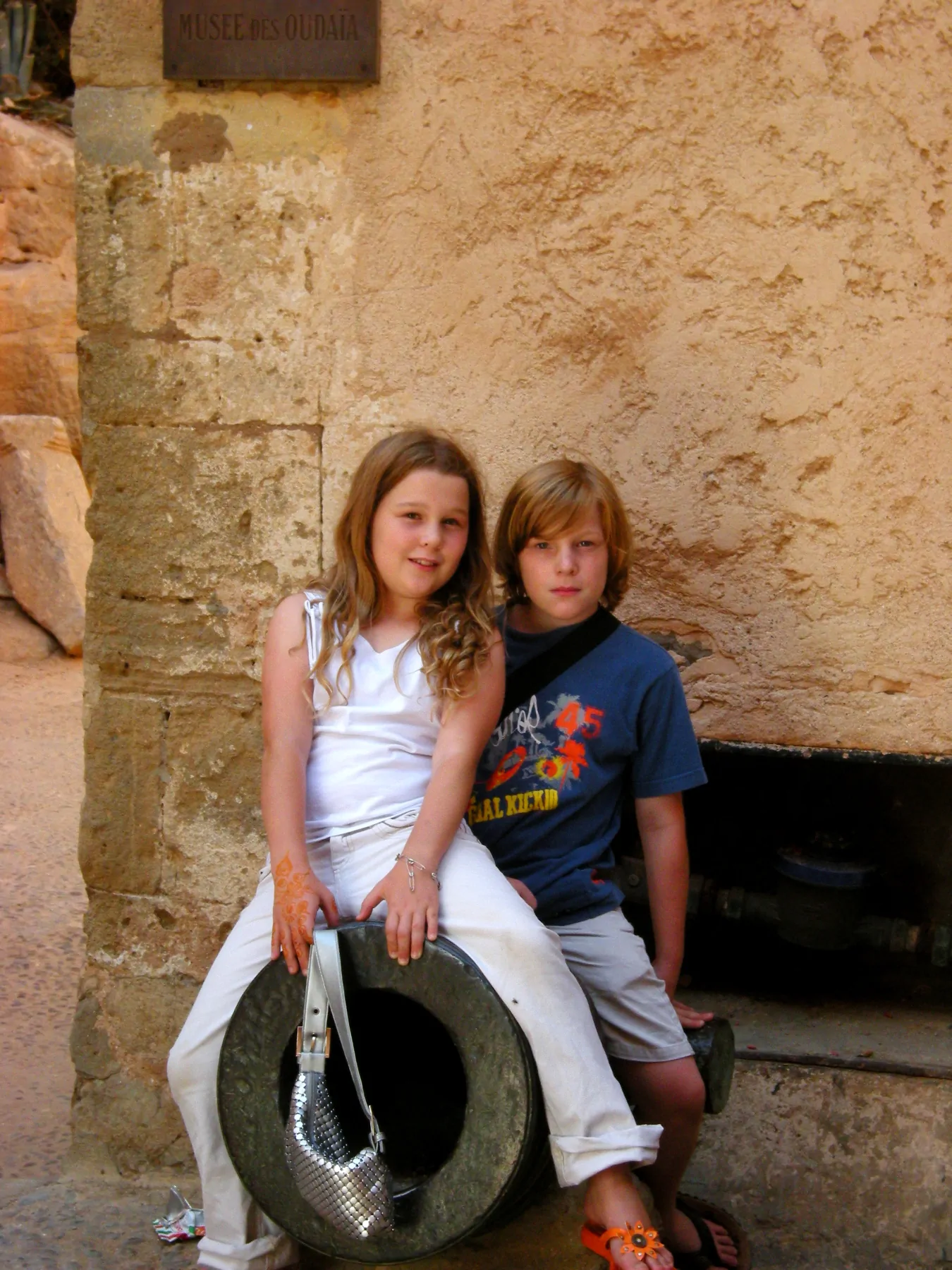 The twins, age 11, posing on a cannon at an old Moroccan fort in Rabat.