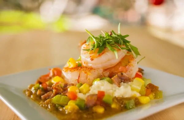 Shrimp and Stone Ground Grits with Andouille Sausage, Sweet Corn, Tomatoes and Cilantro is featured at Florida Fresh Outdoor Kitchen