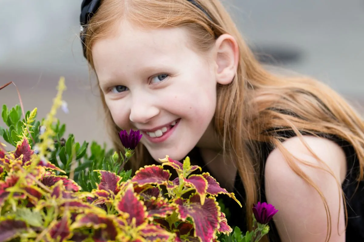 Julia smelling the flowers