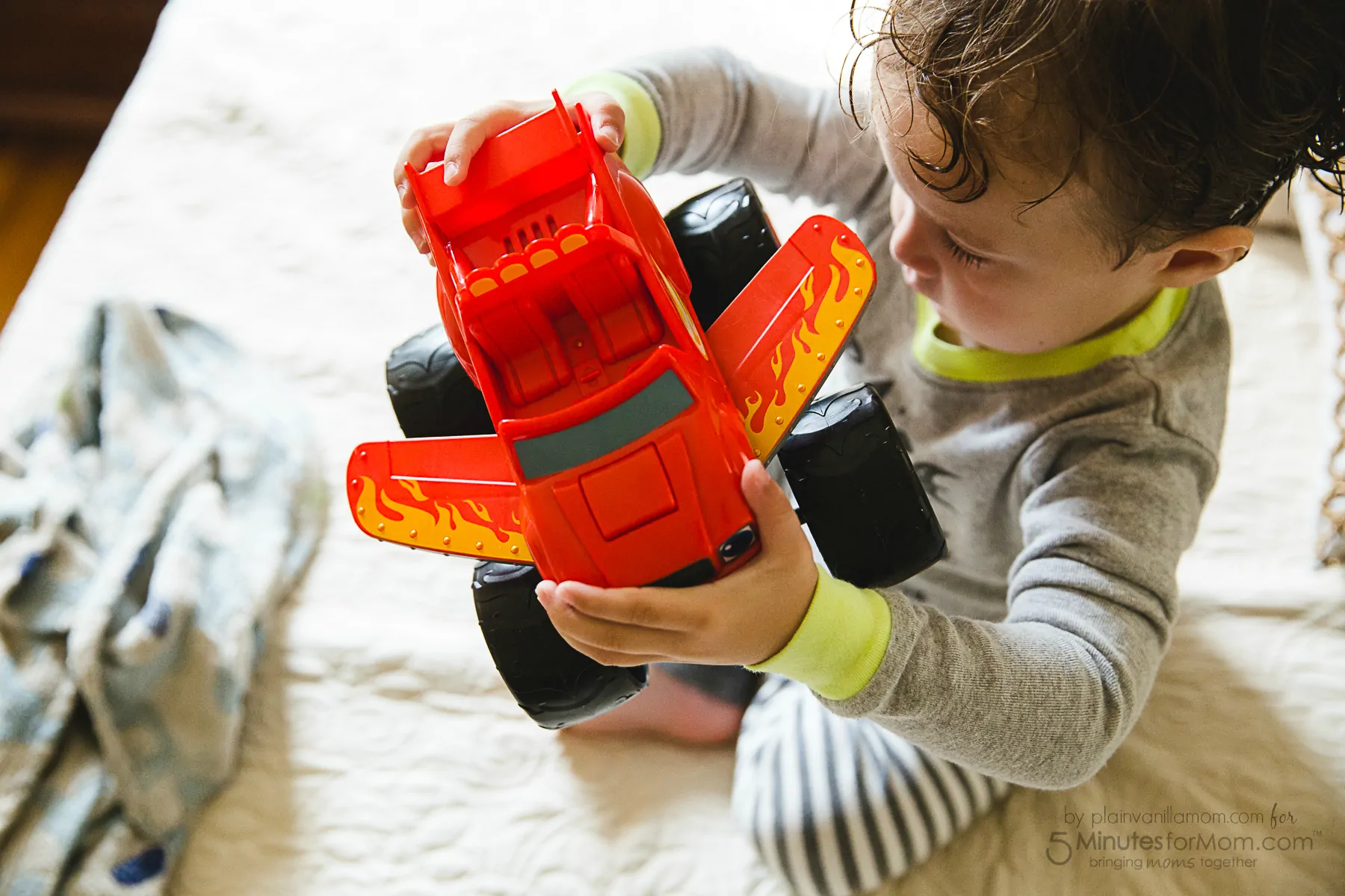 Child playing with transforming jet blaze