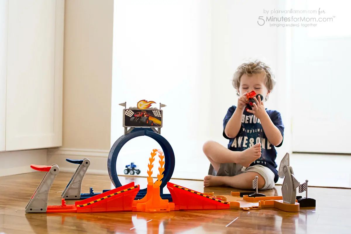 child playing with blaze monster dome