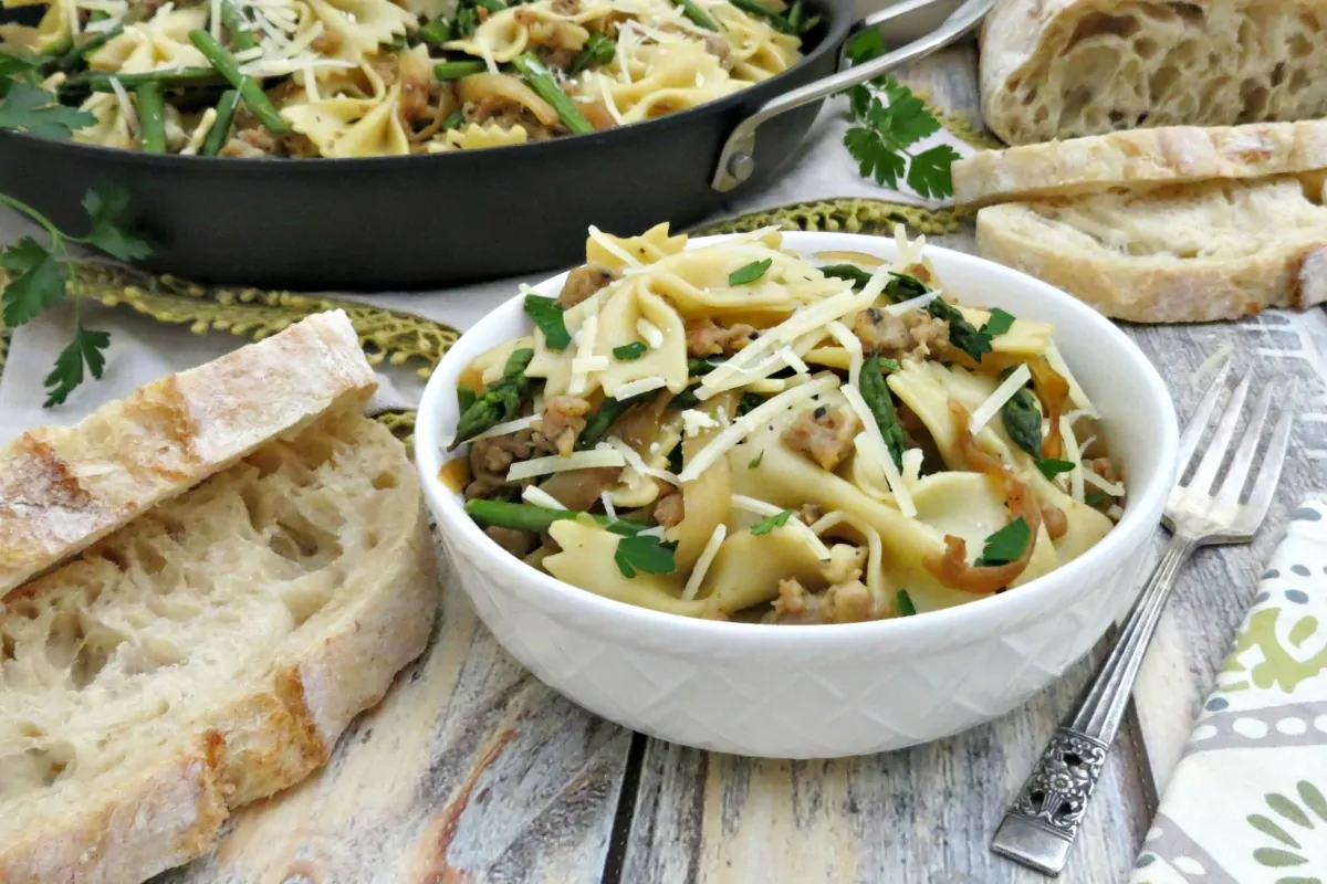 Bowtie Pasta with Chicken Italian Sausage Asparagus and Caramelized Onions