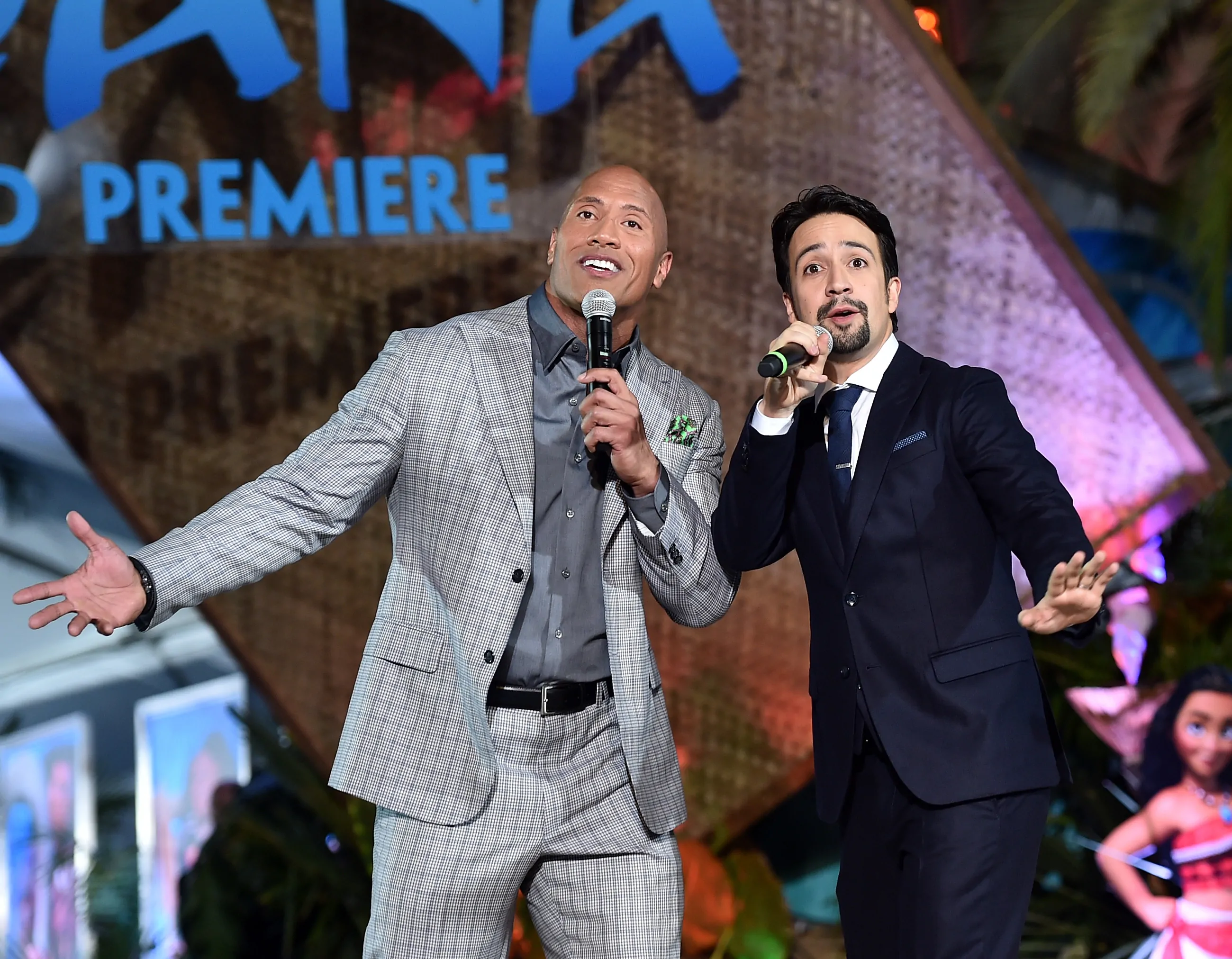 Actor Dwayne Johnson and songwriter Lin-Manuel Miranda perform onstage at The World Premiere of "MOANA" (Photo by Alberto E. Rodriguez/Getty Images for Disney)