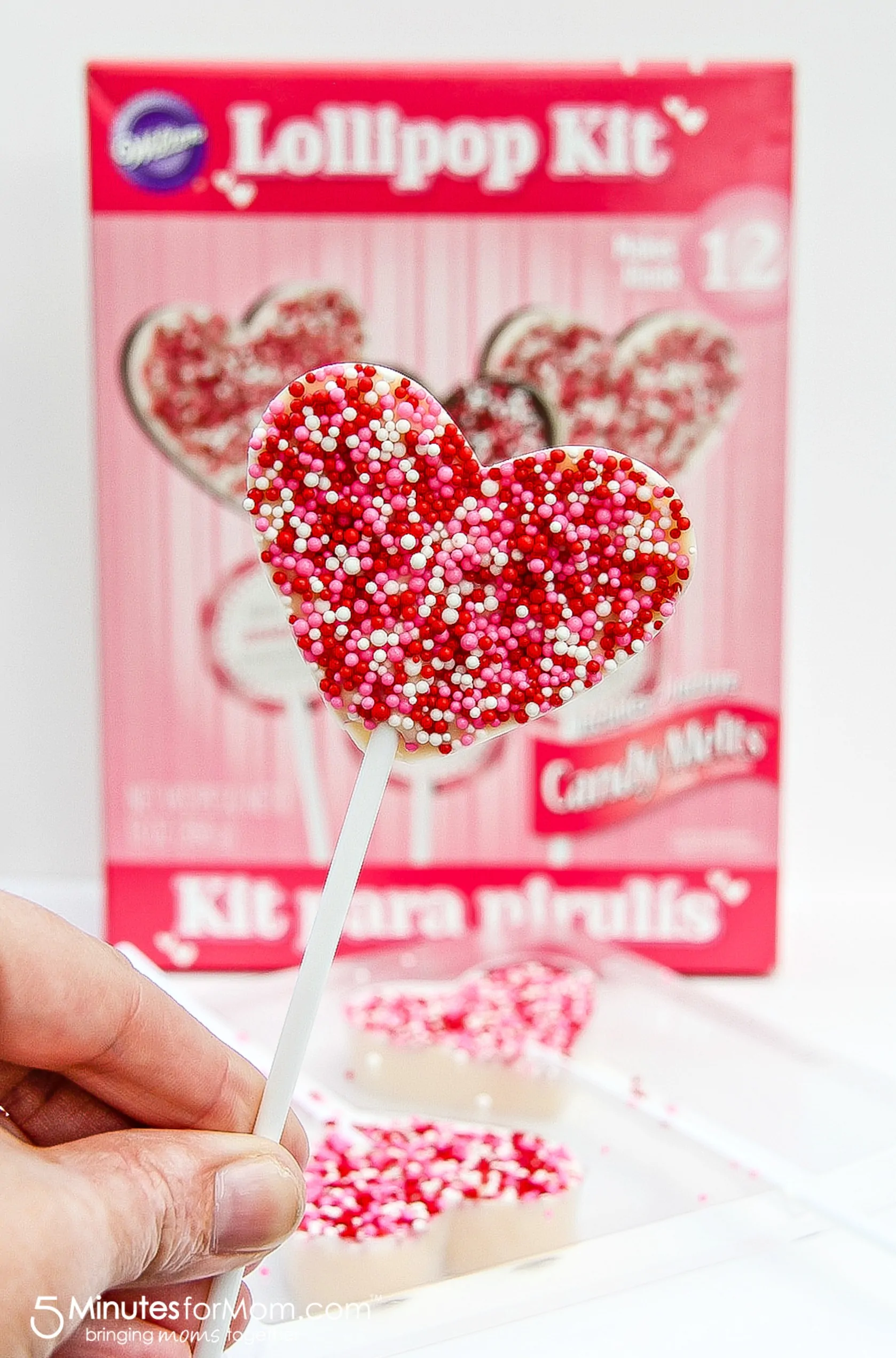 Make heart-shaped chocolate lollipop classrsoom treats with these easy kits from Party City