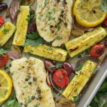 Mediterranean Cod Sheet Pan Dinner. Thinly slicing the garlic and quartering the zucchini ensures that they cook through in the same time as the fish.