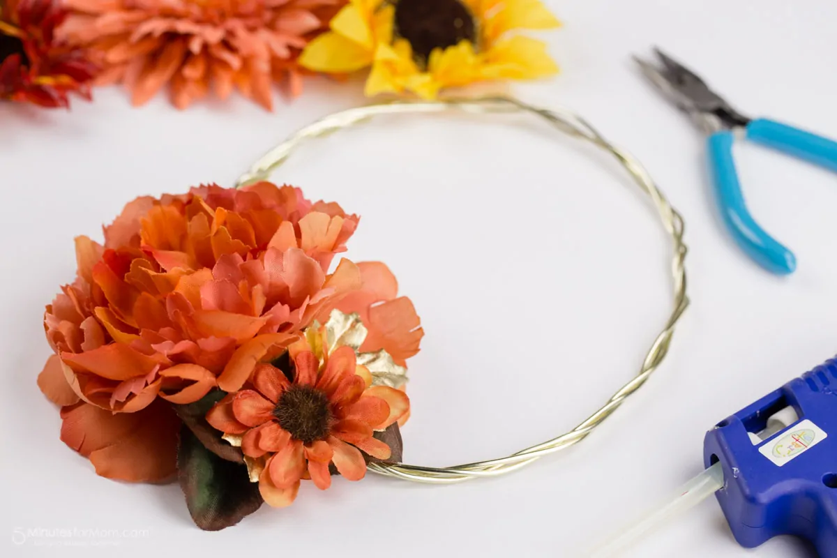 Attach flowers to crown