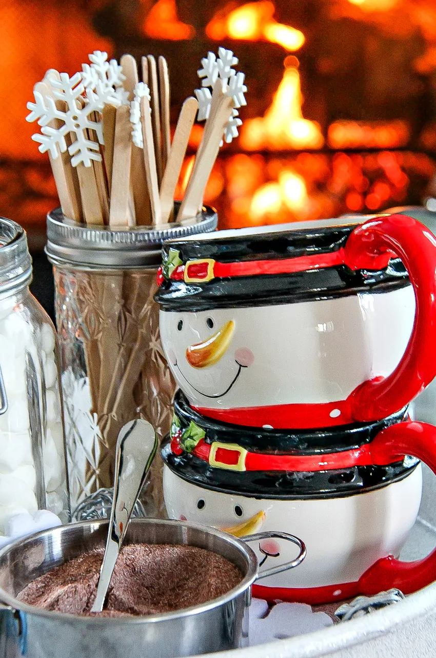 Closeup of snowman mugs and hot chocolate mix