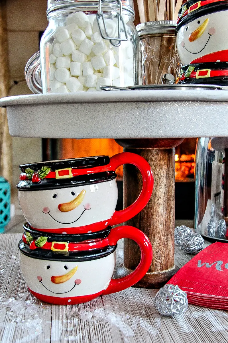 Completed DIY hot chocolate stand with snowman cups.