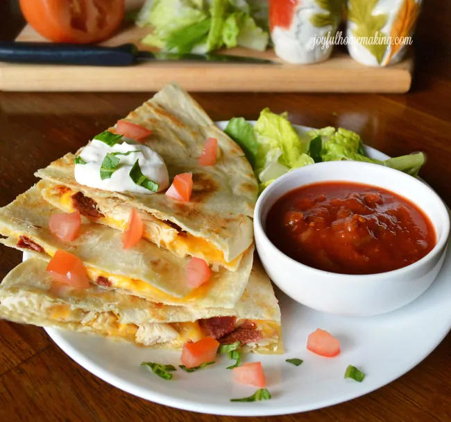 https://www.5minutesformom.com/wp-content/uploads/2018/01/Chicken-and-Bacon-Quesadillas-from-Joyful-Homemaking.webp