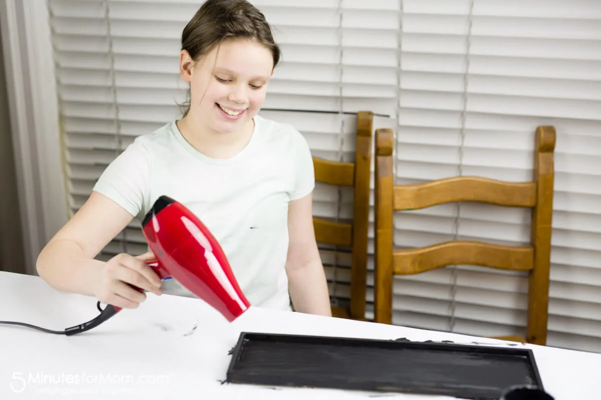 Painting Chalkboard Paint To Make DIY Photo Collage Frame