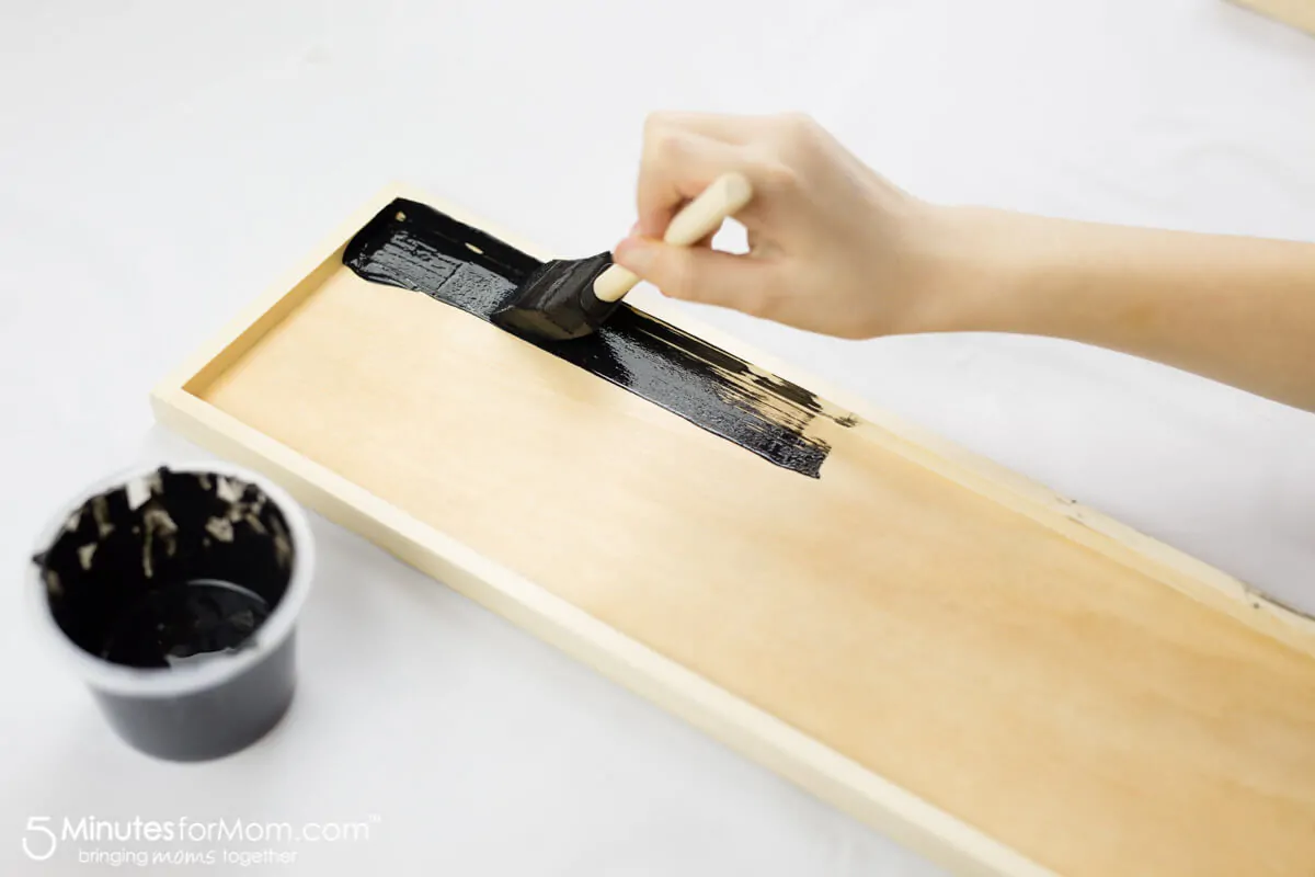 Painting Chalkboard Paint To Make DIY Photo Collage Frame