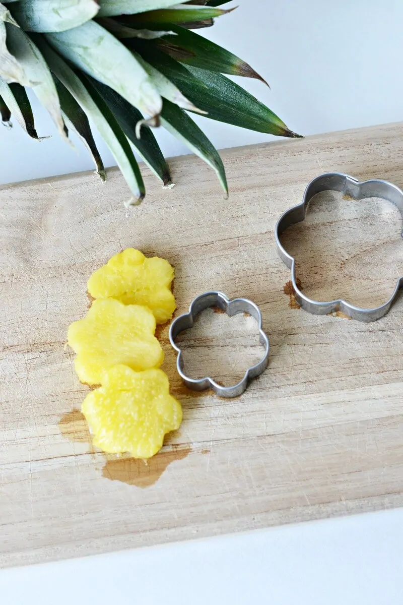 cutting pineapple with a cookie cutter