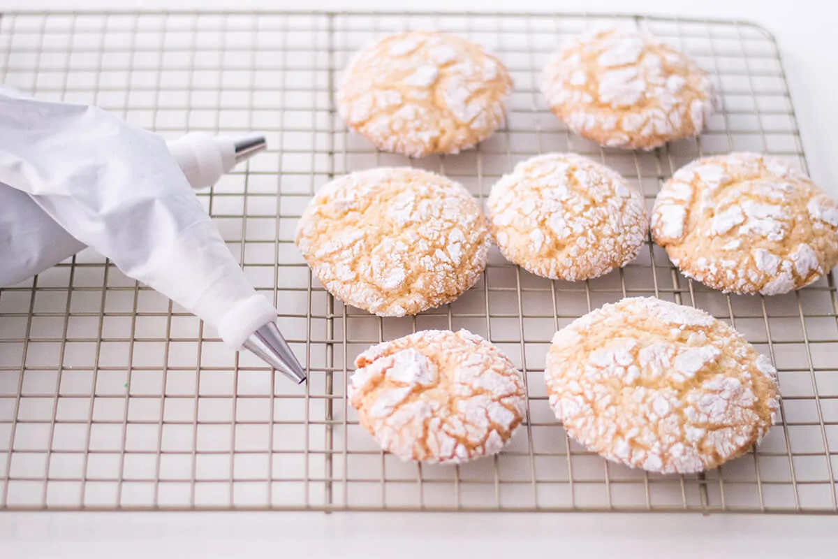 Giving our crinkle cookies a Halloween makeover with buttercream spiders.