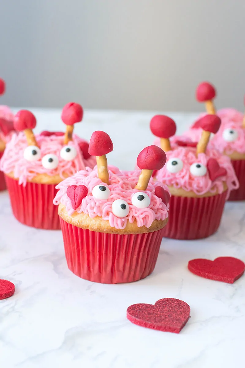 Close up view of furry monster Valentine cupcakes