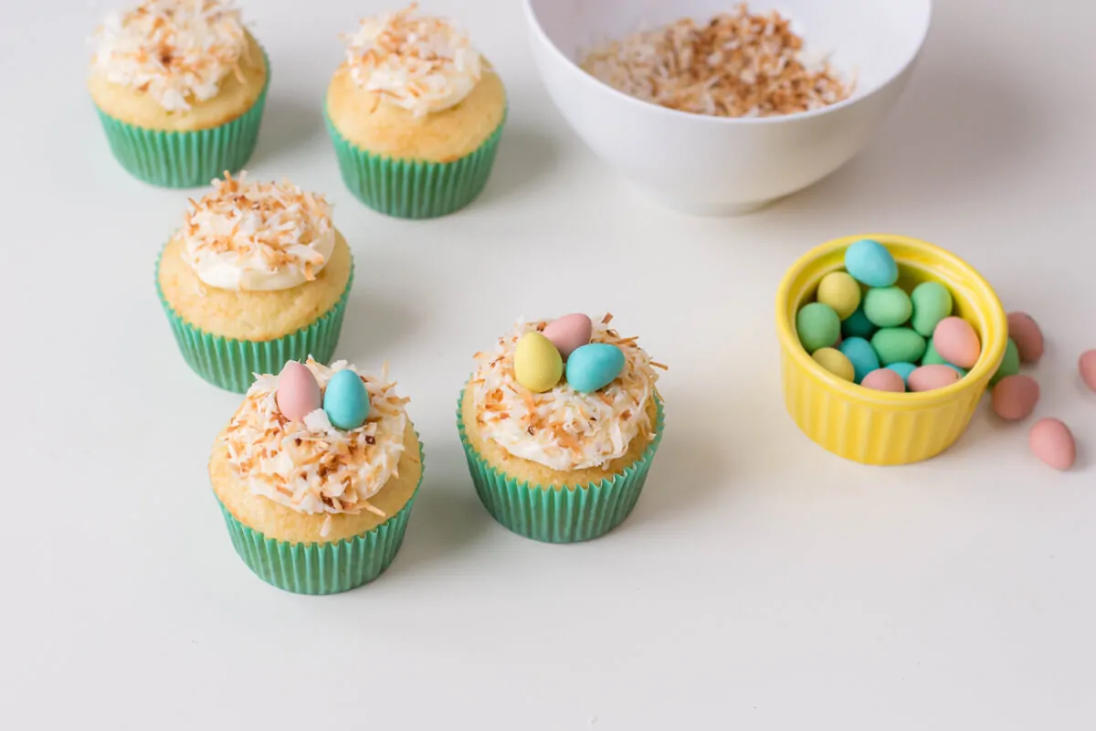 Bird's Nest Cupcakes - Vanilla cupcakes topped with buttercream, shredded coconut and candied eggs.