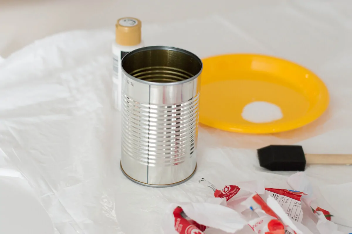 An Easter DIY made of a painted tin can with bunny ears and a pompom nose. Here's our very own Bunny Pencil Holder.