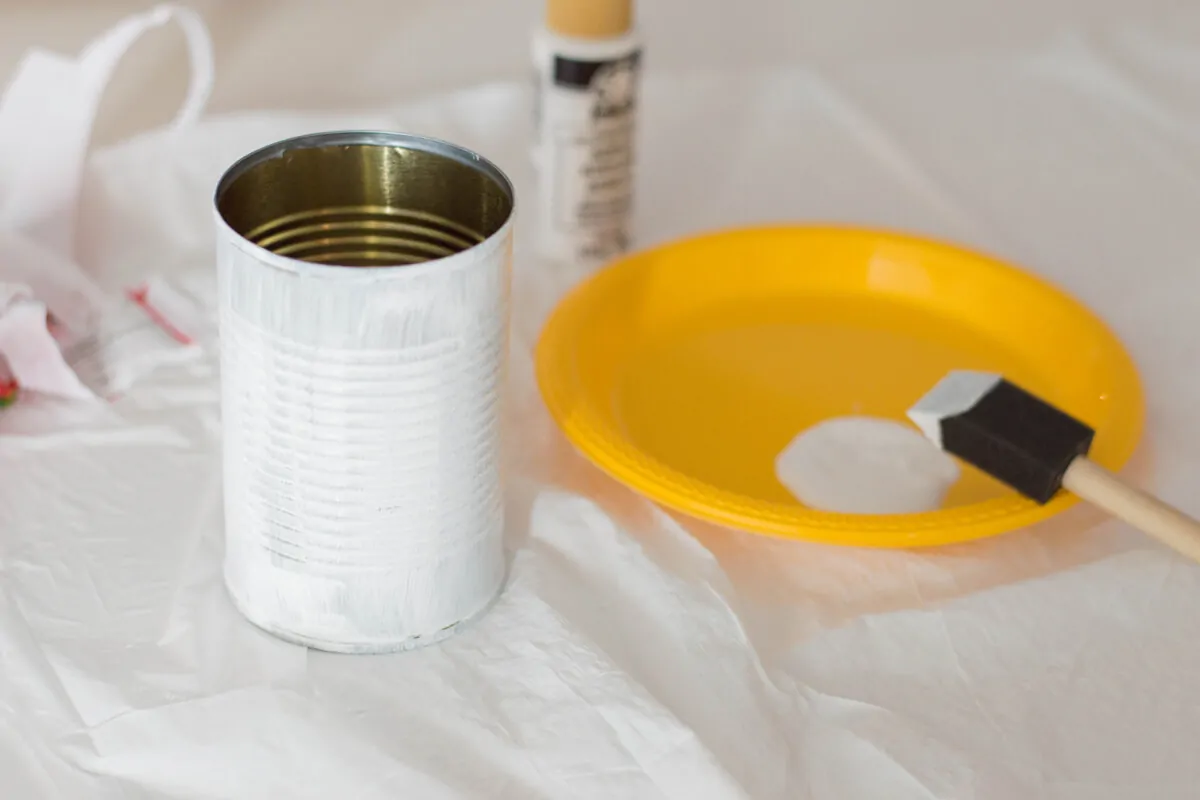 An Easter DIY made of a painted tin can with bunny ears and a pompom nose. Here's our very own Bunny Pencil Holder.