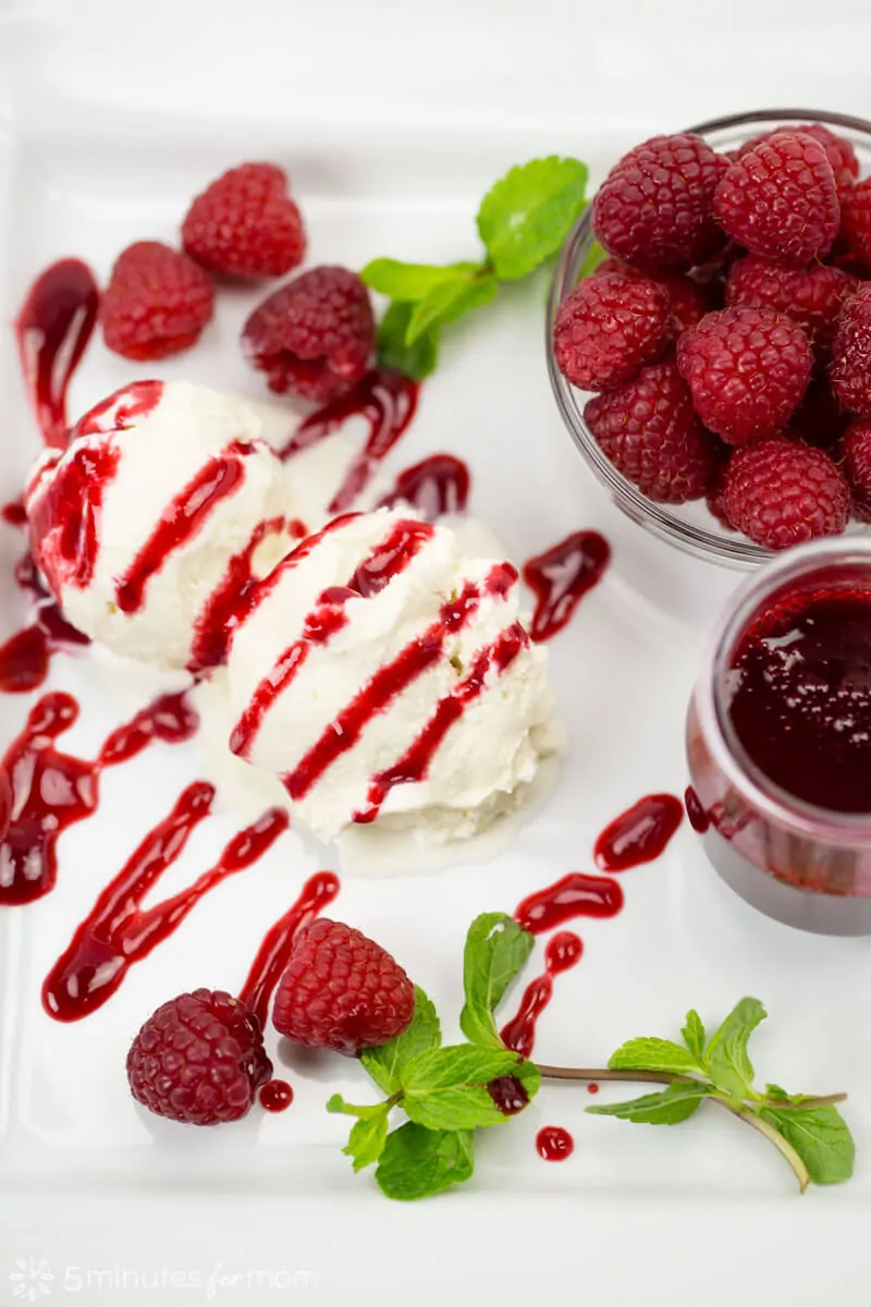 Raspberry coulis drizzled on ice cream