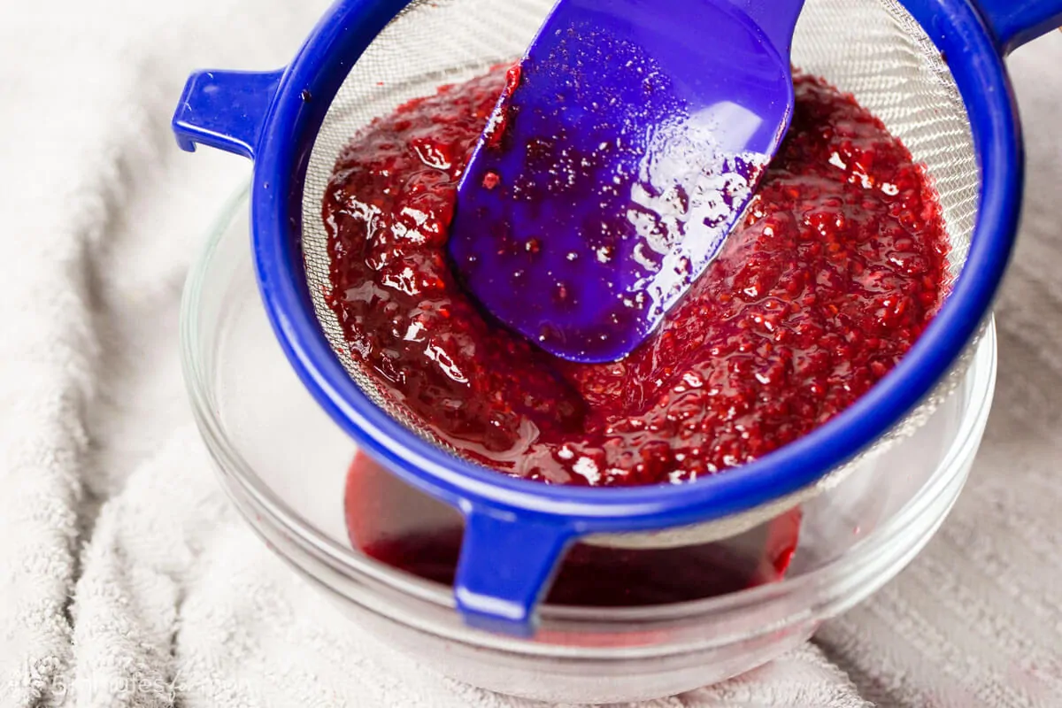 straining seeds through a sieve