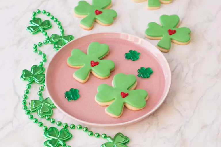 St. Patrick's Day Sugar Cookies shaped as lucky clovers with green fondant and a frosted heart.