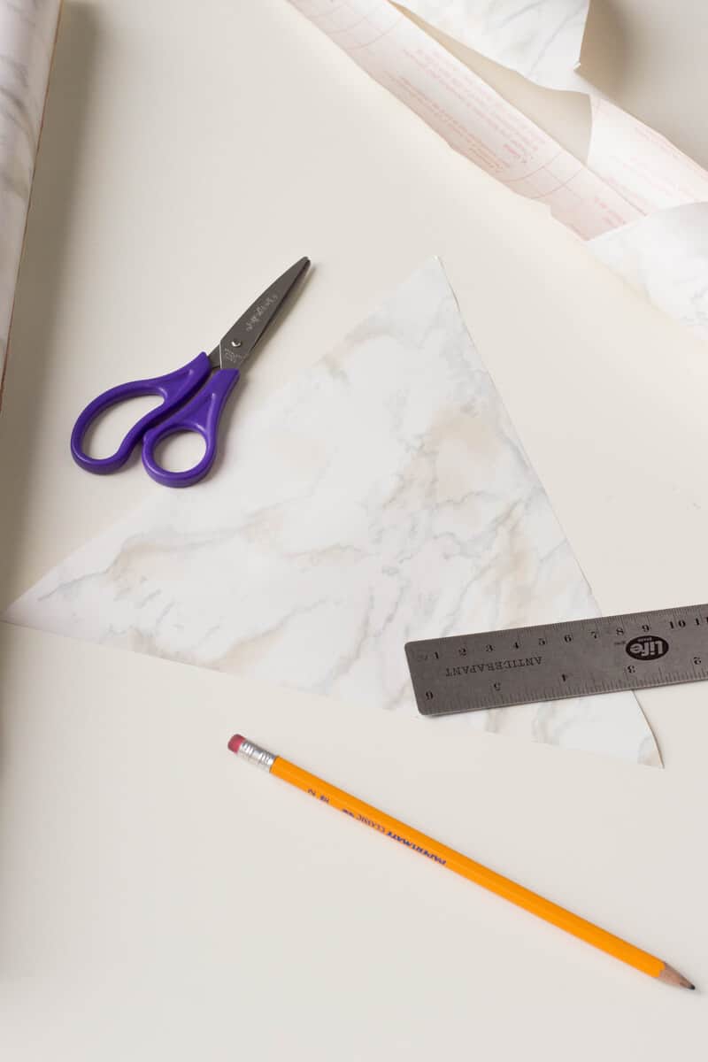 Cut the marble pattern contact paper