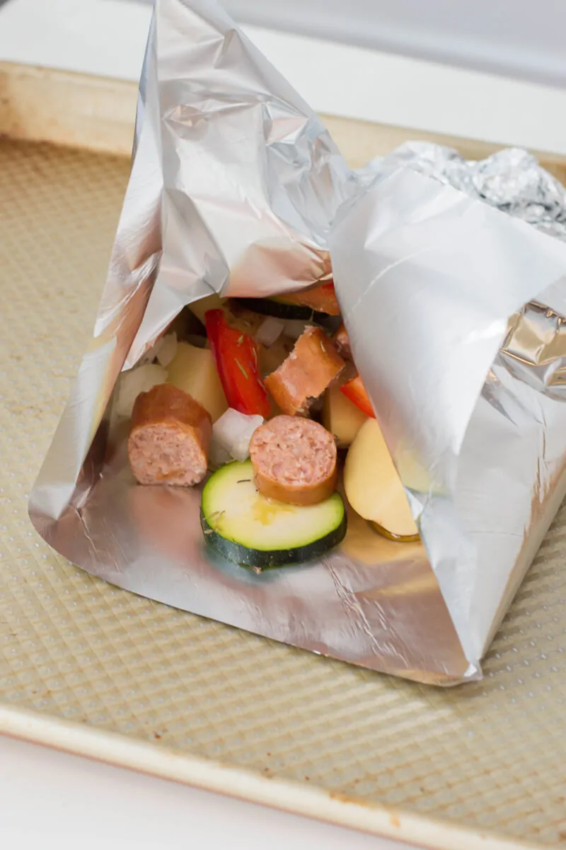 Sausage foil packets are the ideal meals to bring along your camping adventures. Follow along our easy recipe to make them for your family! #campingrecipes #foilpackets #5MinutesforMom