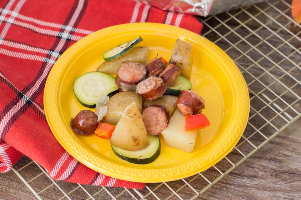 Sausage foil packets are the ideal meals to bring along your camping adventures. Follow along our easy recipe to make them for your family! #campingrecipes #foilpackets #5MinutesforMom