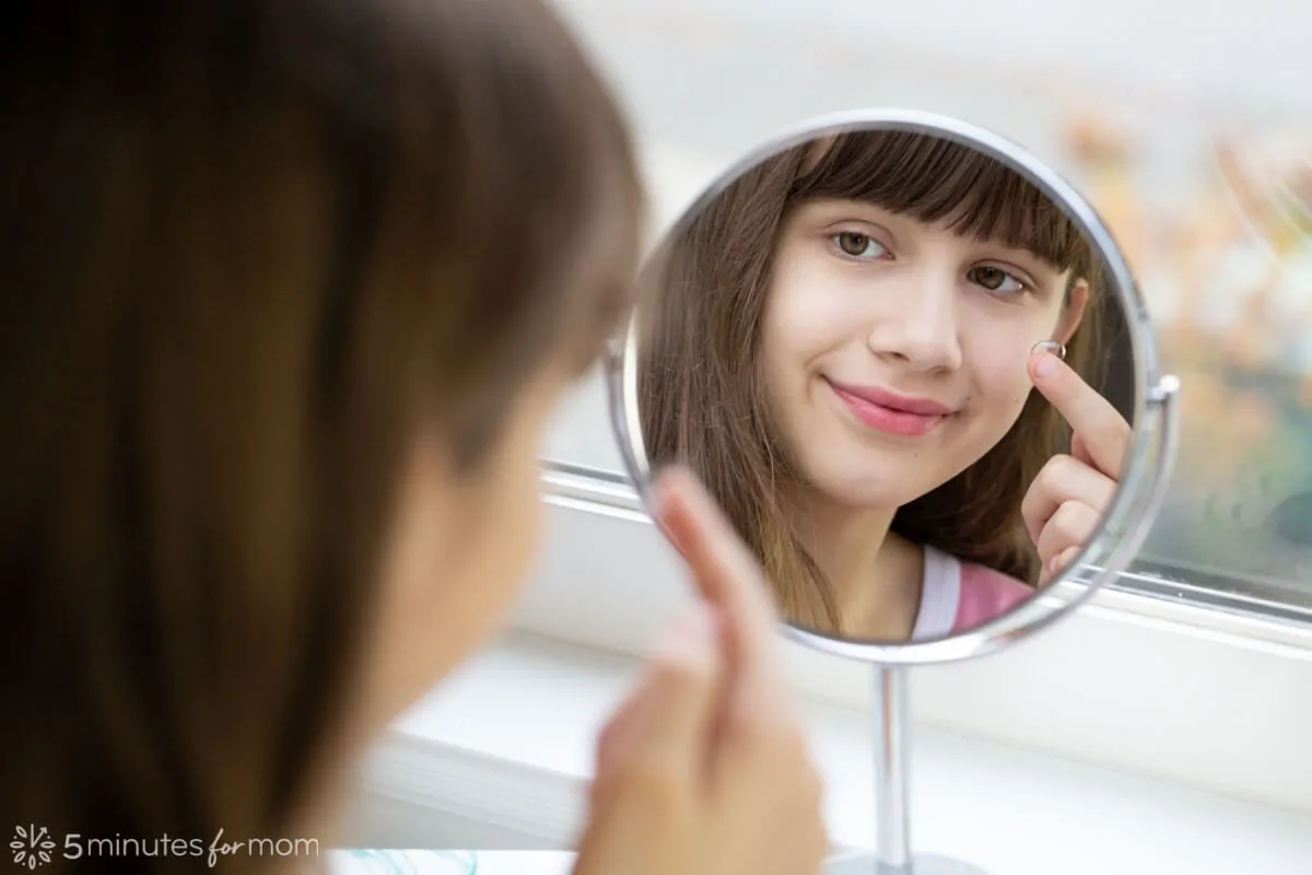 12 year old putting in contact lens