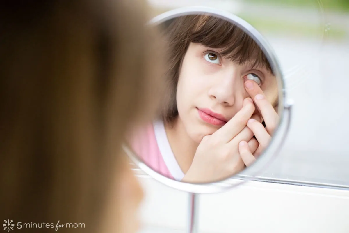 Child putting in contacts