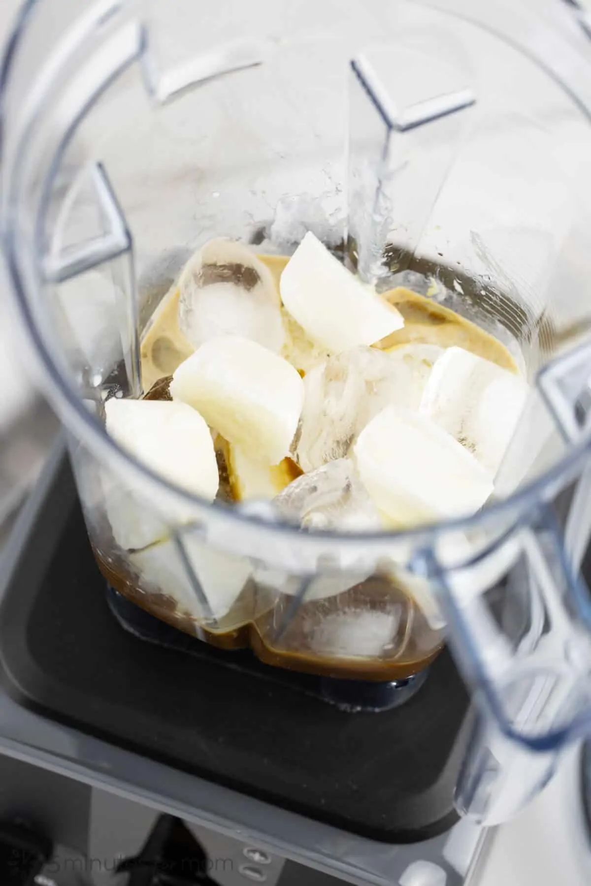 Blending milk cubes ice cubes and coffee