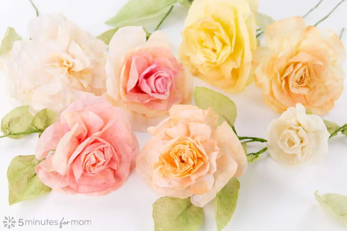 Coffee filter flowers in various shades of light pink and yellow.