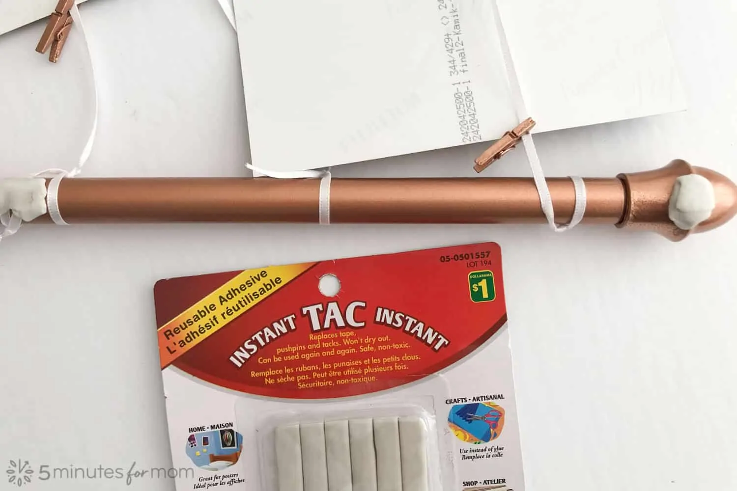 apply reusable adhesive tac to keep rod from scratching wall