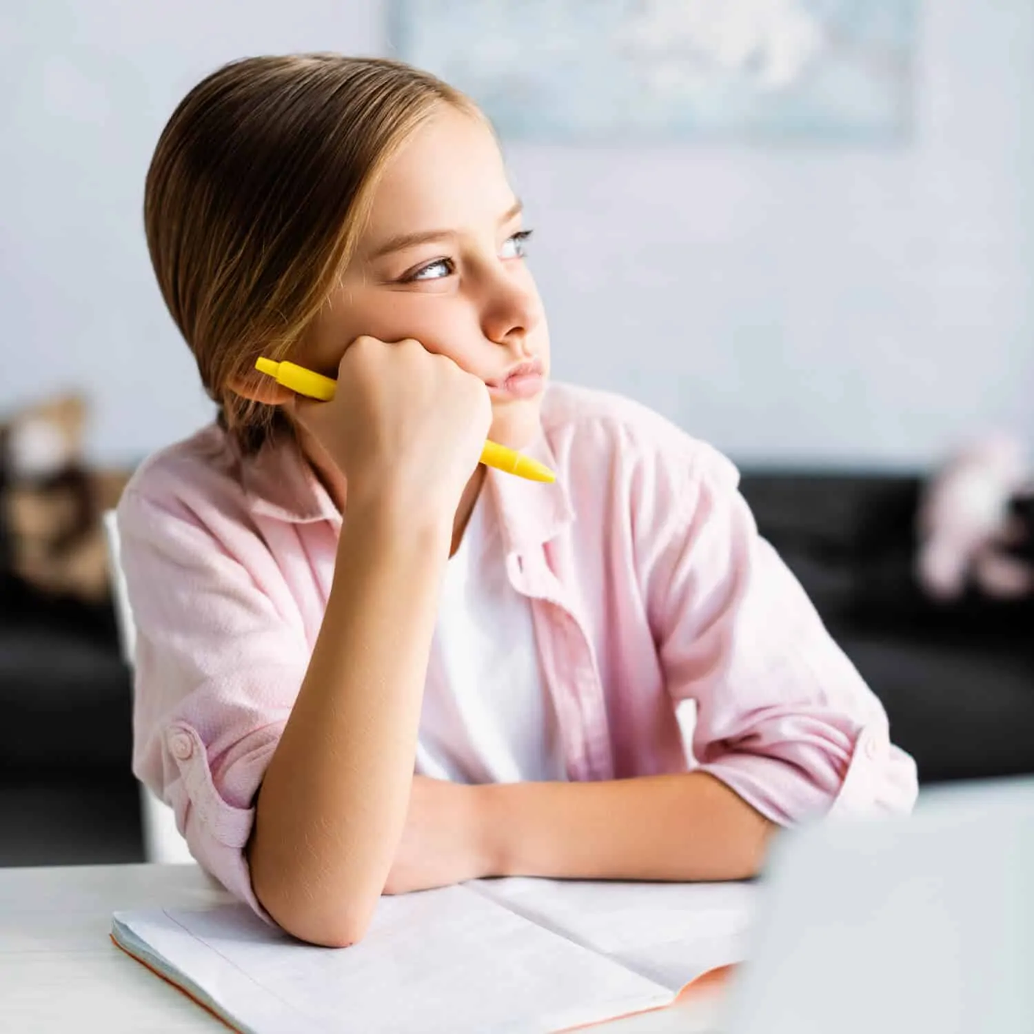 Girl staring out the window struggling with reading and writing - Dyslexia Awareness