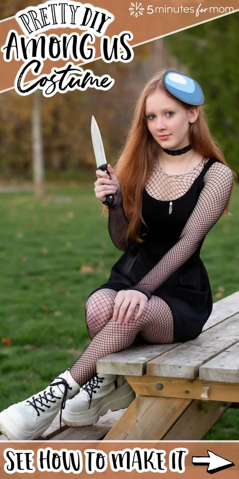 Teen girl dressed in a pretty DIY Among Us Costume. She is dressed as the Imposter in black and holding a knife.