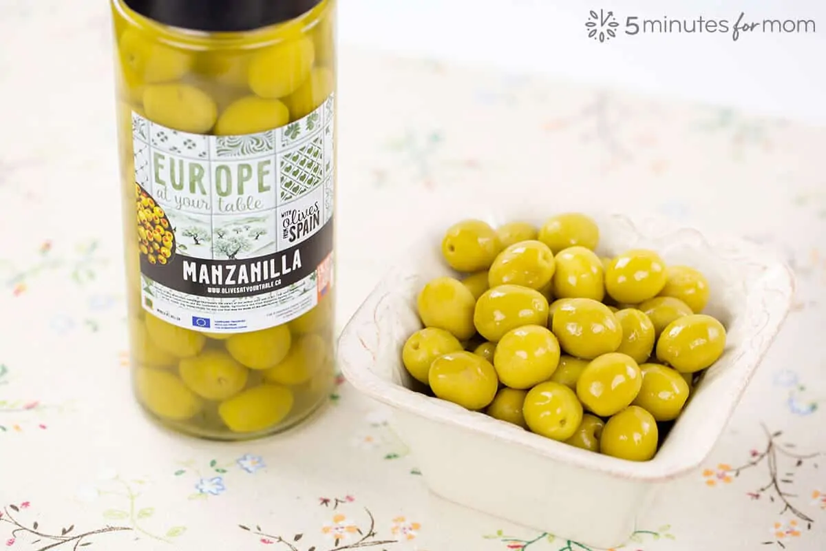 Jar of Manzanilla Olives and Olives in Serving Dish