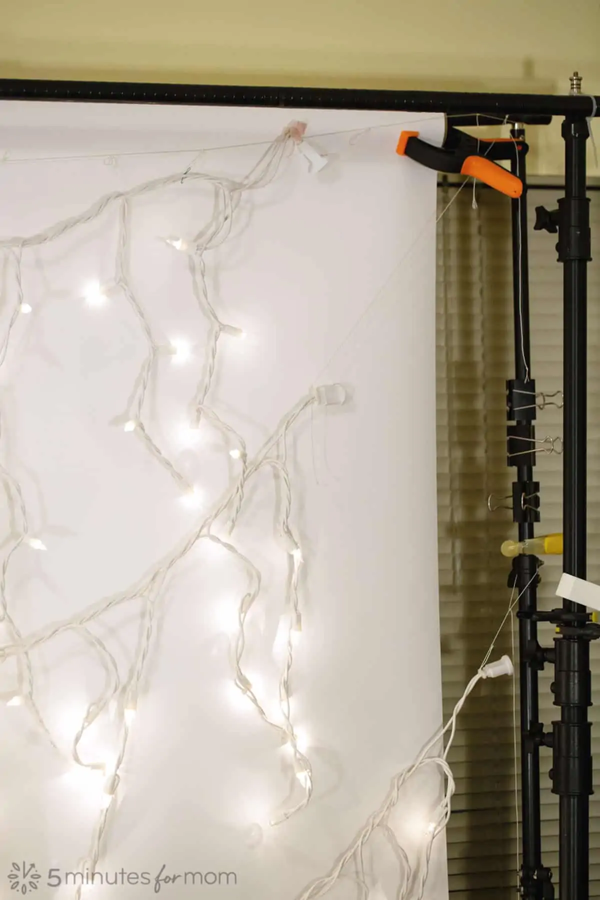 how to set up a sheer fabric photo backdrop with mini lights